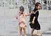 Children play in the fountain at Seoul Forest in Seongdong District, eastern Seoul, on May 21, as sweltering heat and humidity grip the capital. [YONHAP]