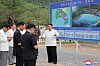 This photo, carried by North Korea's official Korean Central News Agency on July 14, 2025, shows the North's leader Kim Jong-un, right, inspecting the construction site of the Ragwon County Offshore Farm in South Hamgyong Province the previous day. [YONHAP]