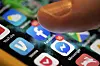 An iPhone displaying the apps for Facebook and Messenger [AP/YONHAP]