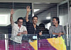 ″Deadpool and Wolverine″ stars Hugh Jackman, left, and Ryan Reynolds wave to fans with director Sean Levy in a game between the LG Twins and Kiwoom Heroes at Gocheok Sky Dome in western Seoul on Wednesday. [NEWS1]