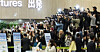 Fans take photos of boy band Seventeen before their flight at Gimpo International Airport on May 9. [NEWS1]