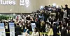 Fans take photos of boy band Seventeen before their flight at Gimpo International Airport on May 9. [NEWS1]