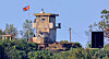 An object that seems to be a loudspeaker appears next to a North Korean military post on the inter-Korean border. [YONHAP]