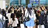 Fans with cameras crowd Incheon International Airport Terminal 2 as actor Byeon Woo-seok arrives on July 16. [NEWS1]