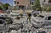 Israeli soldiers work amid the rubble of residential buildings destroyed by an Iranian missile strike that killed several people, in Beersheba, Israel, June 24. [AP/YONHAP]