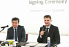 Tools for Humanity CEO and co-founder Alex Blania, right, speaks during a signing ceremony with the American Chamber of Commerce in Korea (Amcham) in eastern Seoul on Tuesday, with Amcham CEO and Chairman James Kim on his left. [AMCHAM]