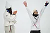 Silver medalist United States' Chloe Kim, left, claps as gold medalist Korea's Choi Ga-on celebrates winning the the women's snowboarding halfpipe finals at the 2026 Winter Olympics, in Livigno, Italy, on Feb. 12. [AP/YONHAP]