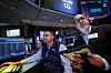 Traders work on the floor at the New York Stock Exchange in New York City on Feb. 17.  [REUTERS/YONHAP]