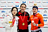 Gold medalist Courtney Sarault of Canada, center, poses for a photograph with Korean silver medalist Choi Choi Min-jeong, left, and bronze medalist Xandra Velzeboer of the Netherlands following the 1000-meter race at the ISU Short Track World Tour speed skating event in Montreal on Oct. 18. [AP/YONHAP]
