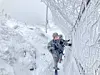 Soldiers from the Army's 21st Infantry Division conduct guard duty while inspecting a snow-covered fence line on the morning of Dec. 12, 2023. At Gachilbong, the Army’s highest observation post at an elevation of 1,242 meters, 11 centimeters of snow fell overnight. [MINISTRY OF NATIONAL DEFENSE/NEWS1]