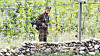 A North Korean soldier stands guard with his gun on the bank of the Yalu River in North Korea's Ryanggang Province on Sept. 25, 2020. [YONHAP]
