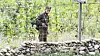A North Korean soldier stands guard with his gun on the bank of the Yalu River in North Korea's Ryanggang Province on Sept. 25, 2020. [YONHAP]