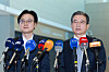 Kim Yong-beom, right, the presidential chief of staff for policy, and Industry Minister Kim Jung-kwan, left, field questions from reporters at Incheon International Airport, west of Seoul, on Oct. 16, before their departure for Washington for trade talks with the United States. [YONHAP]