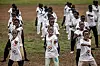 Young refugee girls throw taekwondo punches during a showcase performance at a sports day event at the Kalobeyei Sports Complex in Kalobeyei, Kenya, on March 28. [AFP/YONHAP]