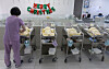 A nurse take cares of newborn babies in a hospital in Seoul last month. [NEWS1]