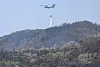 A military helicopter drops water over Mount Hamji as part of firefighting efforts on the second day of the wildfire in Buk District, Daegu, on April 29. [NEWS1]