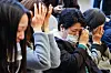Bereaved families of people who died after receiving Covid-19 vaccinations shed tears after a bill for state compensation passed at the National Assembly in western Seoul on April 2. [NEWS1]
