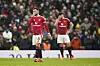 Manchester United's Bruno Fernandes and Harry Maguire reacting to Brighton's third goal scored during a Premier League match in Manchester, England, Sunday, Jan. 19, 2025. [AP/YONHAP]