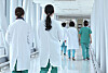 Doctors walk at a hospital in Seoul on Monday, a day after the Korean Medical Association announced a general strike on June 18 to protest the government's decision to increase the medical school quota. [YONHAP]