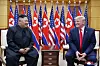 North Korean leader Kim Jong-un, left, and then U.S. President Donald Trump chat in the House of Freedom on the South Korean side of the truce village of Panmunjom on June 30, 2019. [KOREAN CENTRAL NEWS AGENCY]