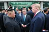 Former South Korean President Moon Jae-in, center, former U.S. President Donald Trump, right, and North Korean leader Kim Jong-un converse during their historic meeting at Panmunjom in June 2019. [YONHAP]