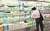 A customer looks at eggs at a retail store in Seoul on June 26. [YONHAP]
