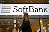 A woman walks in front of SoftBank store in Ginza shopping district in Tokyo, Japan, on Jan. 20, 2020. [AP/YONHAP]