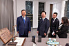 President Lee Jae Myung, second from left, and Chinese President Xi Jinping, left, smile as they exchange gifts after their summit meeting on the sidelines of the APEC gathering in Gyeongju, North Gyeongsang, on Nov. 1. [YONHAP]