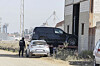 Spanish police officers seize a vehicle stored inside a warehouse in Isla Mayor, Seville, Spain, on Nov. 11. [EPA/YONHAP]