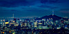 Panoramic image of Seoul downtown cityscape illuminated with lights and N Seoul Tower in central Seoul. [GETTY IMAGES BANK]