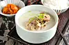 Gomtang, or slow-simmered beef bone soup, served with spicy radish kimchi [GETTY IMAGES BANK]