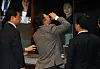 Conservative People Power Party (PPP) Rep. Kim Sang-wook, center, composes himself before voting on the impeachment motion after returning to the National Assembly chamber following the ruling party's walkout before the vote on Saturday. [YONHAP]