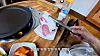 A screenshot from a YouTube video shows pork belly with a large portion of fat served at a restaurant on Ulleung Island. [SCREEN CAPTURE]