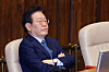 Democratic Party leader Lee Jae-myung listens to the debate over a special counsel probe bill being pushed by his party in the National Assembly in Yeouido, western Seoul, on Thursday. [NEWS1]