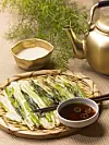Pajeon, a pan-fried Korean pancake, is served with makgeolli, or sweet rice wine [GETTY IMAGES BANK]