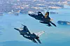 KF-21, top, and KF-16 fighter jets conduct a test flight above an air base in Sacheon, South Gyeongsang, on Feb. 19. [NEWS1]