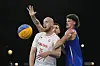 Adrian Bogucki of Poland passes, defended by France's Jules Rambaut, back, and Franck Seguela, right, in a men's 3x3 basketball match between Poland and France in Paris on Wednesday. [AP/YONHAP]