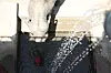 Kosuni, a 56-year-old female elephant at Dalseong Park Zoo in Daegu, eats frozen watermelon in her enclosure on July 9. [NEWS1]