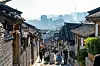 Tourists roam around the alleyways of the Bukchon Hanok Village, a hanok cluster in Jongno District, central Seoul, in November 2023. [JOONGANG ILBO]