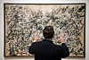 David Brenneman, director of collections and exhibitions at the High Museum, talks about Jackson Pollock's painting ″Number 1A″ on display as part of an exhibit in Atlanta, on Oct. 6, 2011. [AP/YONHAP]