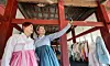 People wearing hanbok (traditional Korean dress) take photos during an event during 2024 Hanbok Culture Week at Changgyeong Palace in central Seoul on Oct. 16, 2024. [NEWS1]