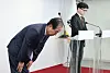 Prime Minister Han Duck-soo, left, bows, during his public address with conservative People Power Party leader Han Dong-hoon in western Seoul on Sunday morning. [YONHAP]