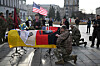 Servicemen pay tribute next to the coffins of slain Korean and U.S. volunteer soldiers of the 2nd International Legion during a farewell ceremony on Independence Square in Kyiv, Ukraine, on Nov. 25 amid the Russian invasion of Ukraine. [AFP/YONHAP]
