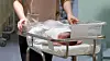 A nurse cares for a newborn at a hospital in Michuhol District, Incheon, on Feb. 26. [NEWS1]