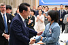 President Yoon Suk Yeol, left, greets judoka Huh Mi-mi, an Olympic medalist, during a luncheon event for descendants of independence fighters at the Blue House in central Seoul on Wednesday, on the eve of Liberation Day. [JOINT PRESS CORPS]