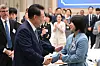 President Yoon Suk Yeol, left, greets judoka Huh Mi-mi, an Olympic medalist, during a luncheon event for descendants of independence fighters at the Blue House in central Seoul on Wednesday, on the eve of Liberation Day. [JOINT PRESS CORPS]