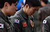 Colleagues of Navy officers who died in the patrol aircraft crash in Pohang, North Gyeongsang, on May 29 shed tears while paying respects to the deceased at a memorial alter set up in the Pohang Naval Air Command gymnasium on May 30. [YONHAP]