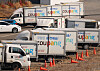 Coupang delivery trucks are parked in Seoul on Feb. 26, 2025. [YONHAP]