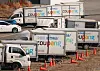 Coupang delivery trucks are parked in Seoul on Feb. 26, 2025. [YONHAP]