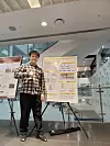 Ying Wei Wang poses for a photo at a forum where he presented the research paper that he coauthored. [YING WEI WANG]